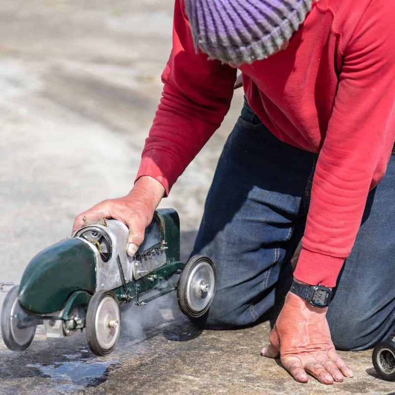 Man launches model race car